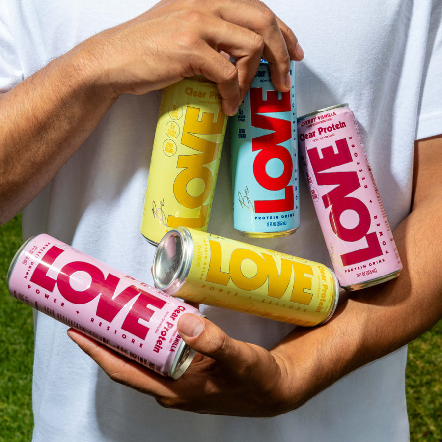Be LOVE Clear Protein cans — Lemon Drop, Rocket Pop, Peach Mango