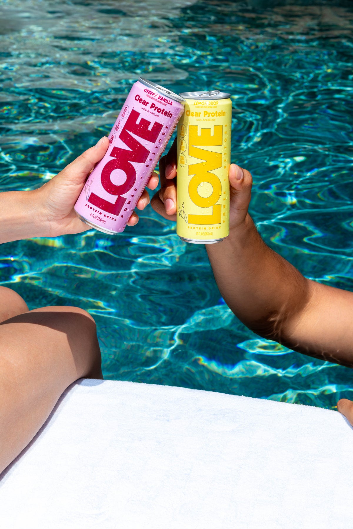 Cherry Vanilla and Lemon Drop LOVE clear protein cans by the pool