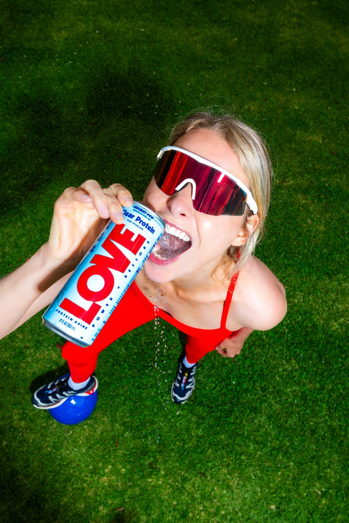 Athlete drinking Rocket Pop LOVE clear protein